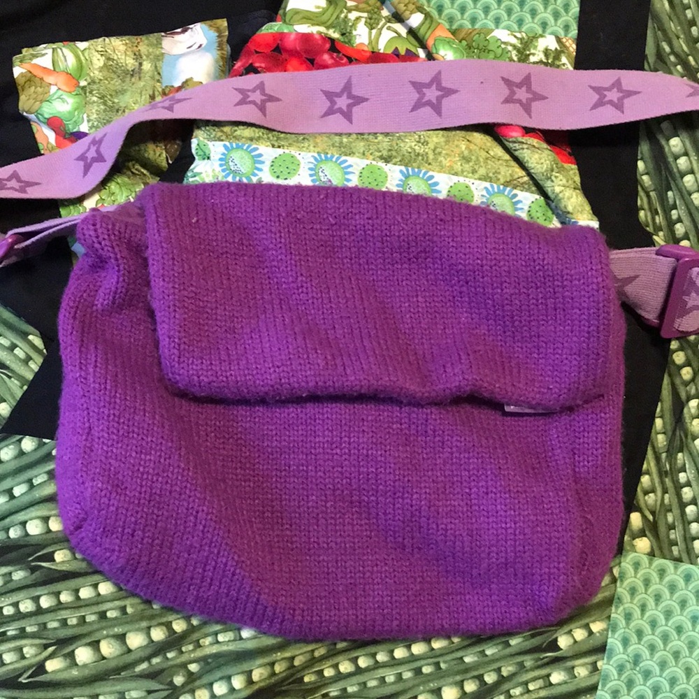 Purple knit American girl bag. Strap has stars